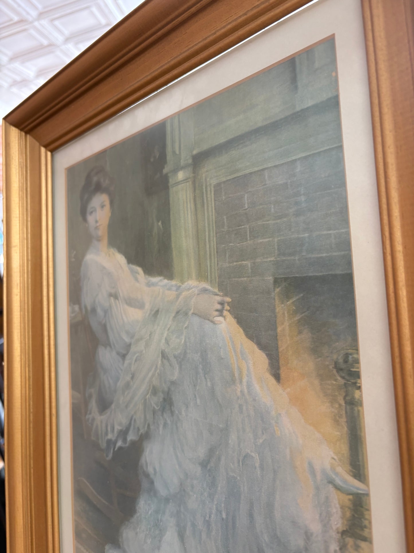 Edwardian Lady by the Hearth – Framed Print in Gilt Wood, 19″ × 15″