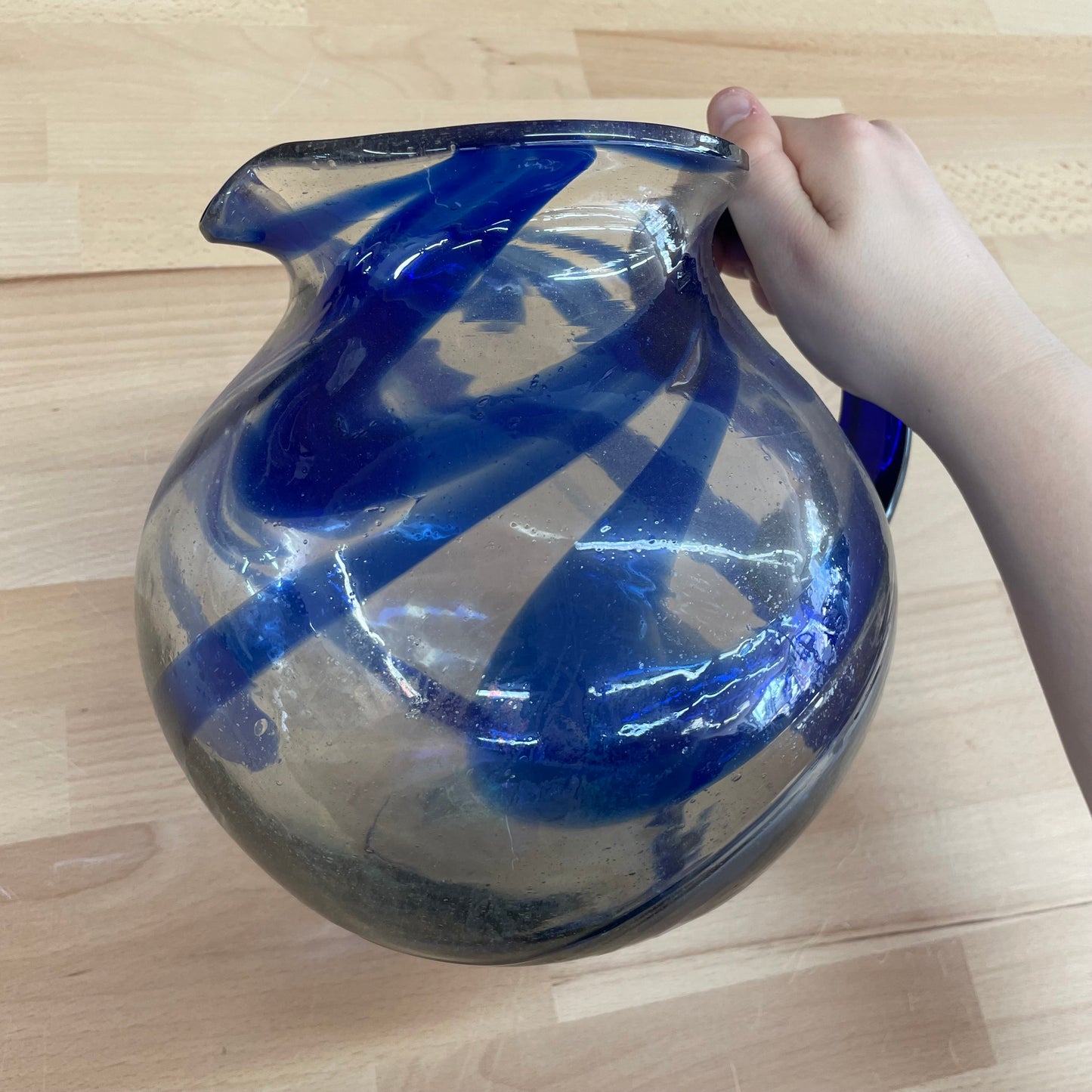 Hand Blown Mexican Glass Pitcher with Blue Swirl Design and Curved Handle