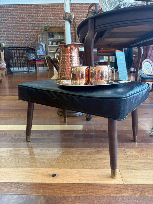 Mid-Century Black Vinyl Footstool – Crawford No. 3994 with Brass Leg Detail