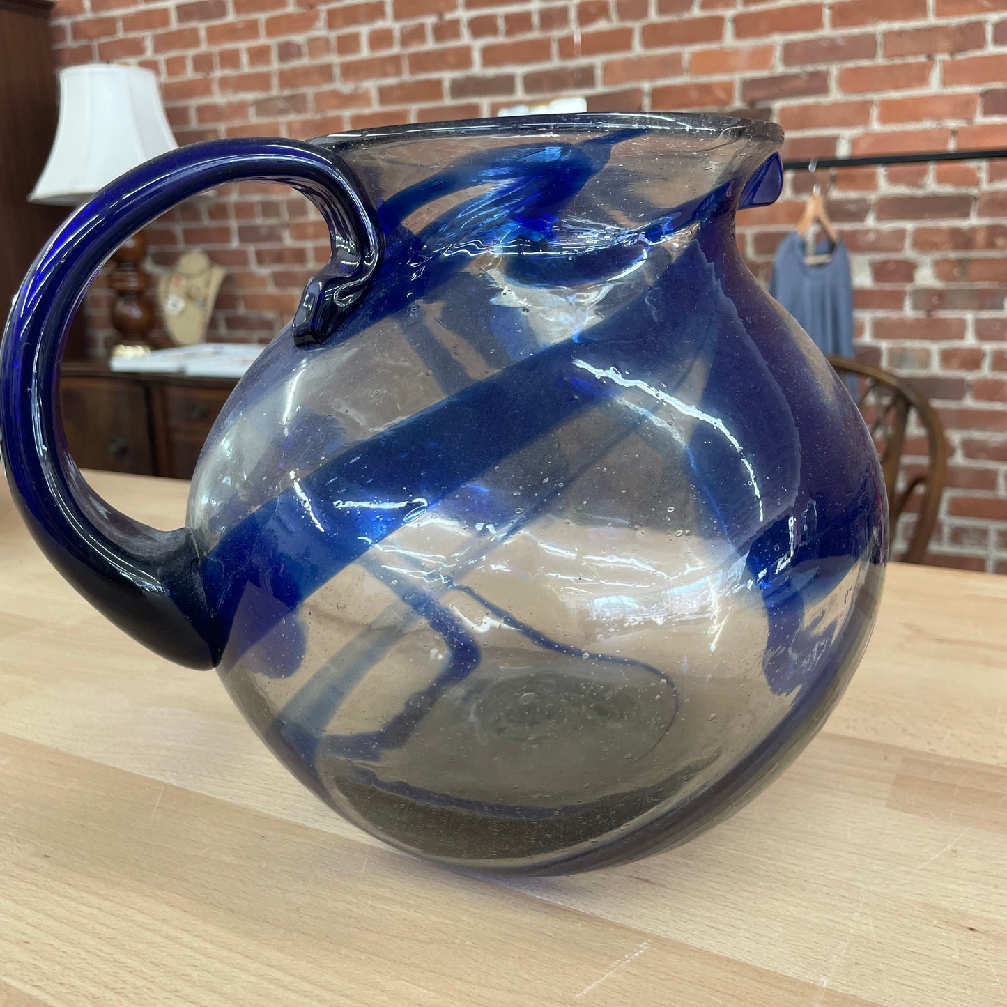 Hand Blown Mexican Glass Pitcher with Blue Swirl Design and Curved Handle
