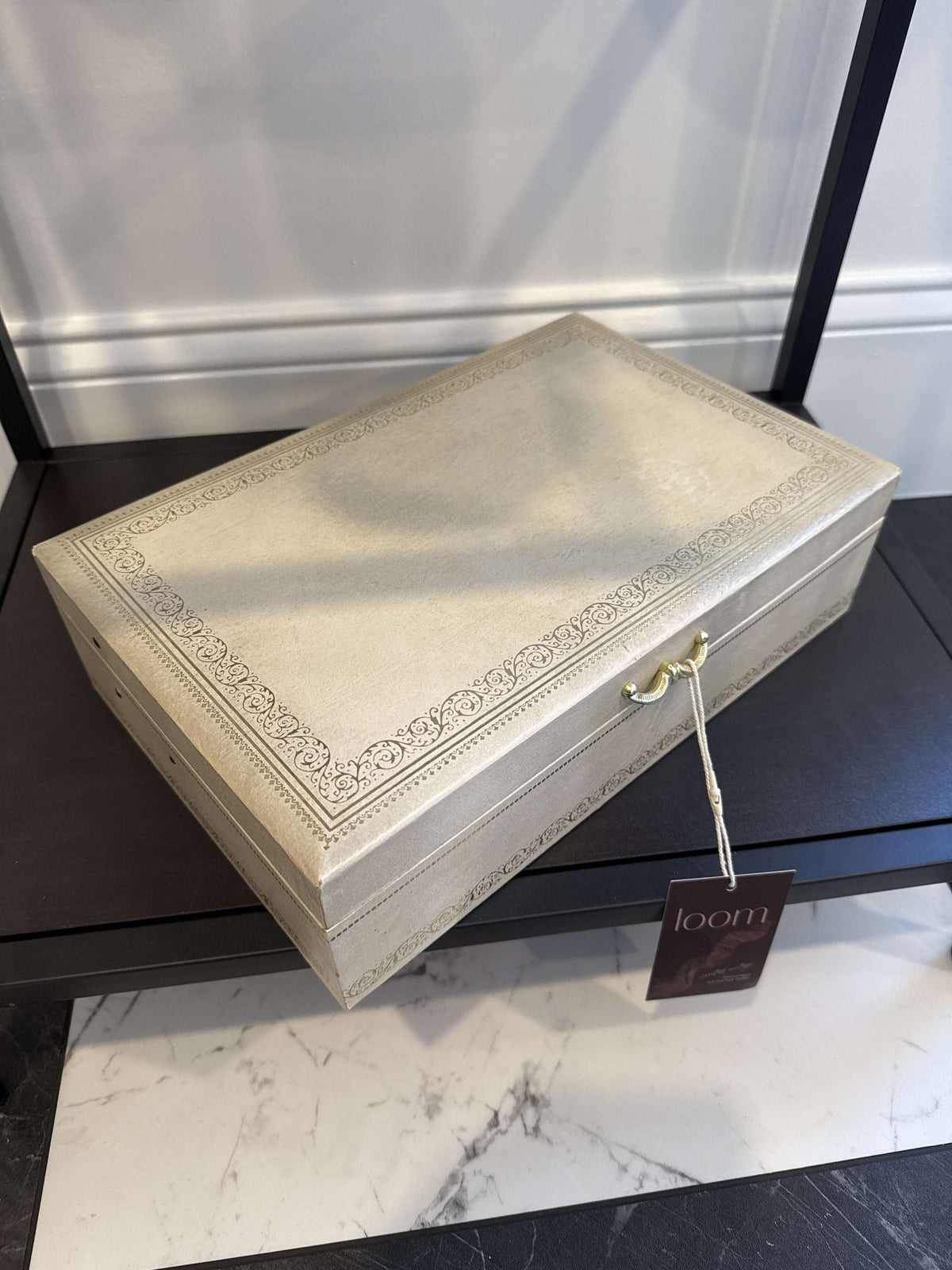 Mele ivory jewelry box closed, with gilt trim
