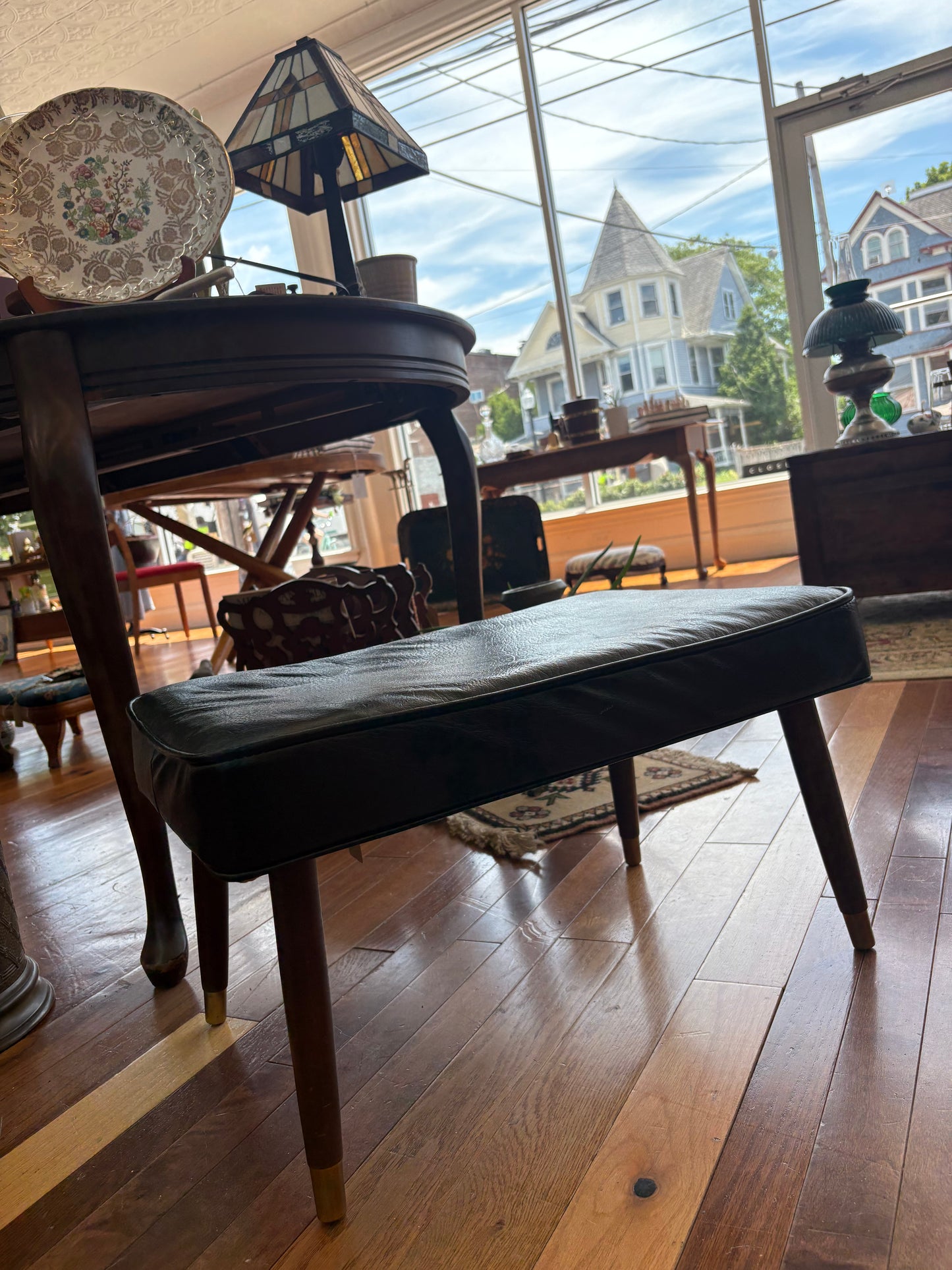 Mid-Century Black Vinyl Footstool – Crawford No. 3994 with Brass Leg Detail