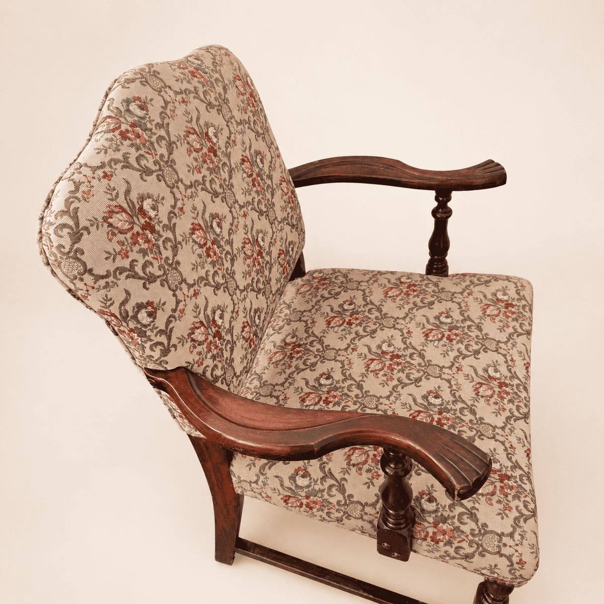 Detail of the floral tapestry upholstery on the Georgian Revival armchair
