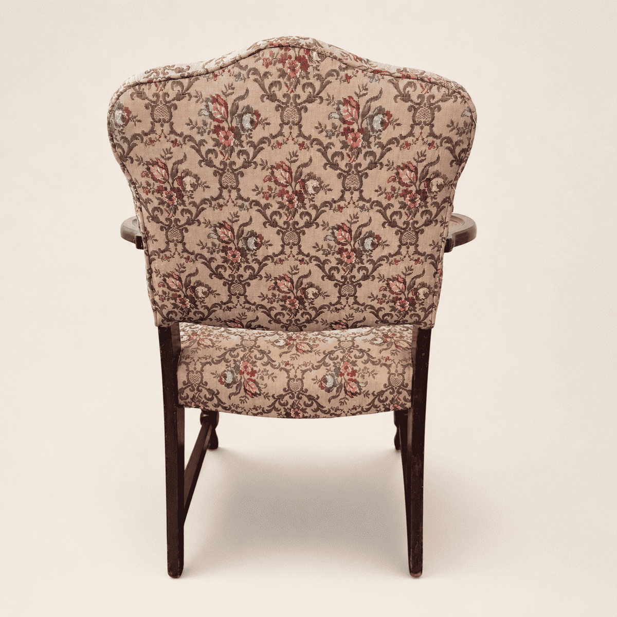 Turned front legs and box stretcher of the antique Georgian Revival armchair