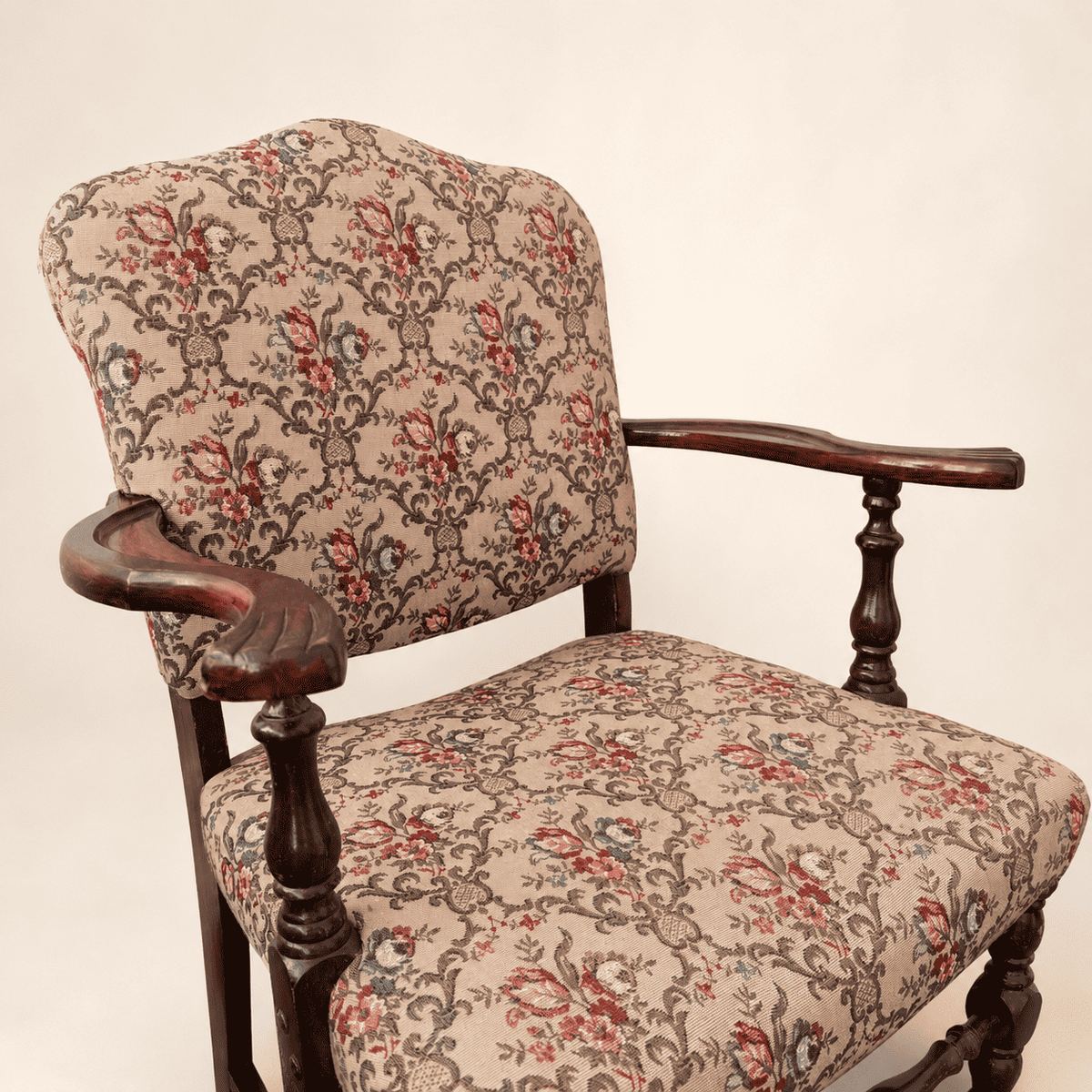 Antique Georgian Revival floral tapestry armchair, angled view