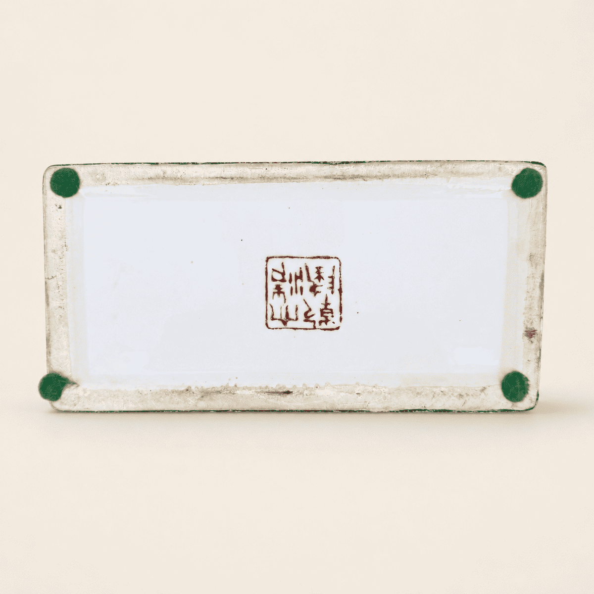 Base of porcelain box with red seal mark and felt pads