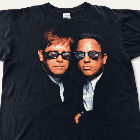 Elton John Billy Joel 1994 all-over-print tee front, big portrait in American and UK flag sunglasses
