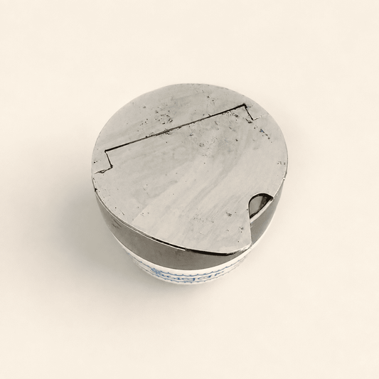 Top-down view of the closed chrome flip-top lid