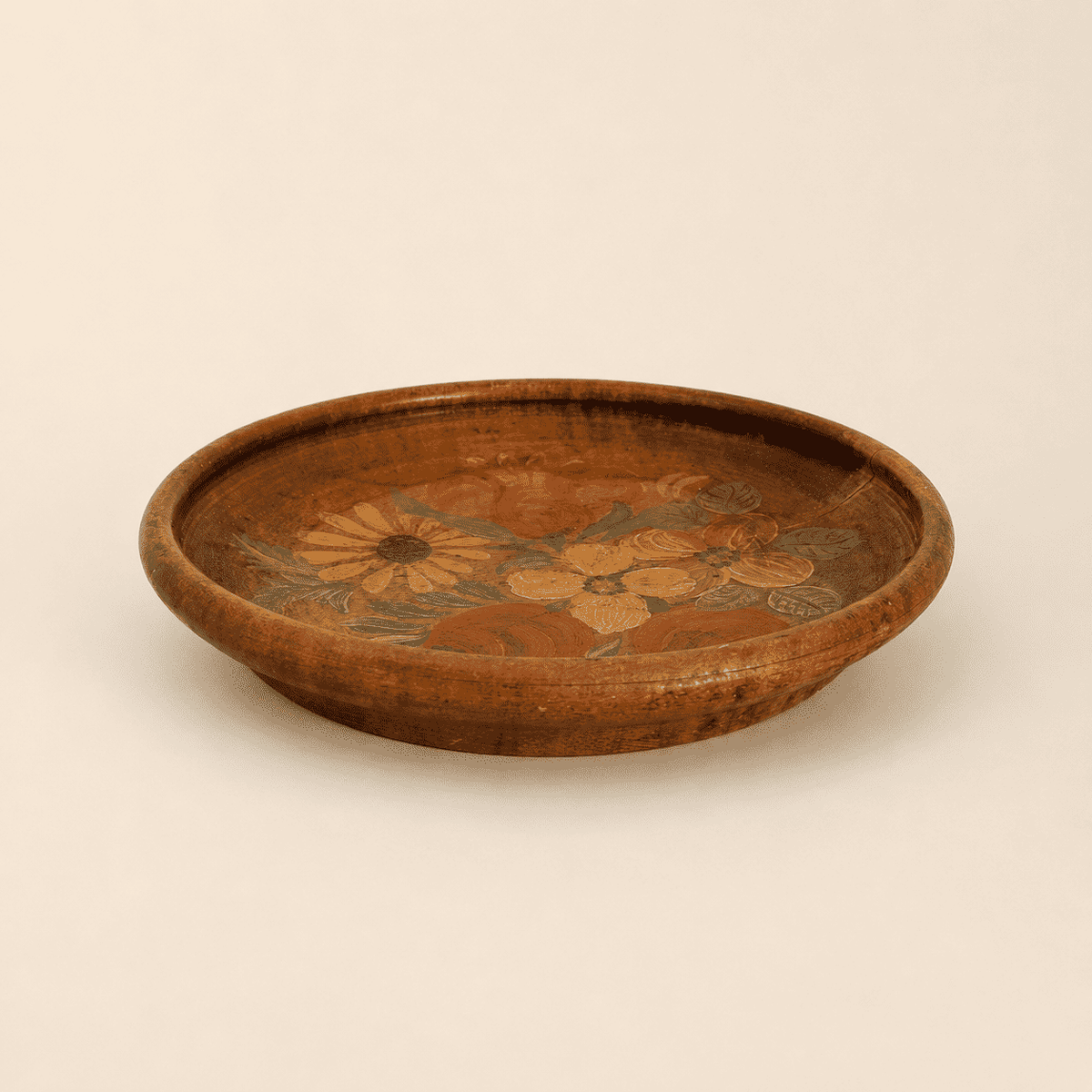 Side profile of turned wood folk plate showing raised rim and depth