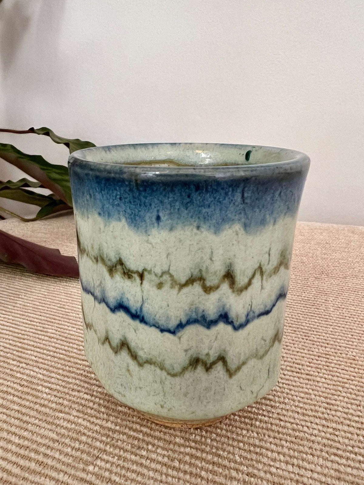 Pair of vintage studio pottery handleless tea cups with blue and celadon wavy glaze, photo 9 of 10