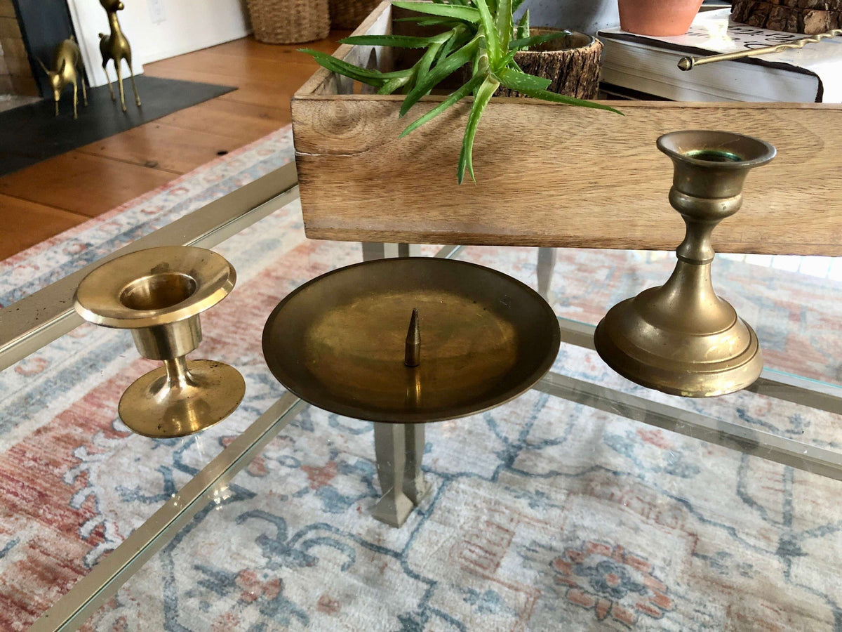 Vintage brass candlesticks — overhead view of the graduated set