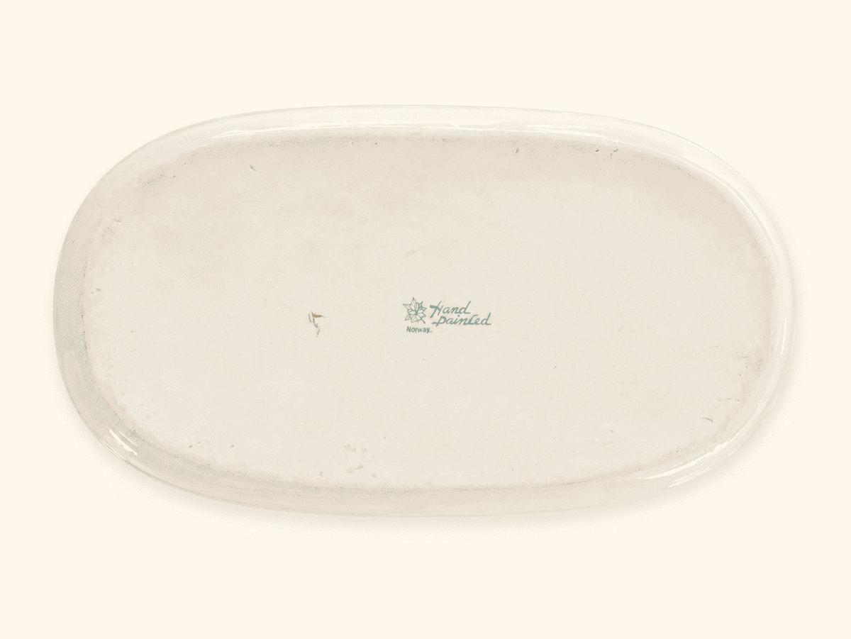 Green maple leaf Nippon backstamp on the underside of an antique porcelain dish