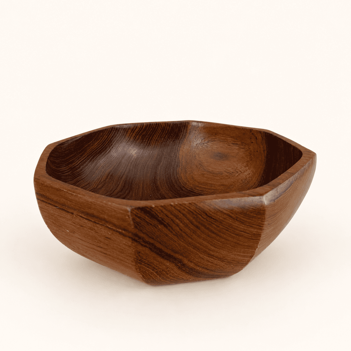Octagonal teak wood bowl in Danish modern style, angled view showing faceted sides