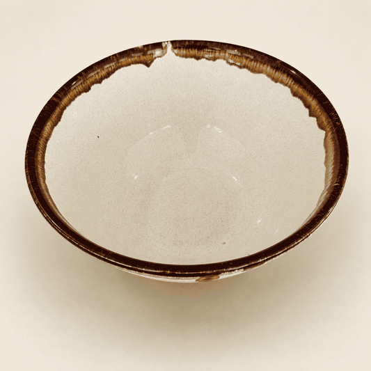 Interior of Pfaltzgraff Country Casual bowl showing speckled cream glaze