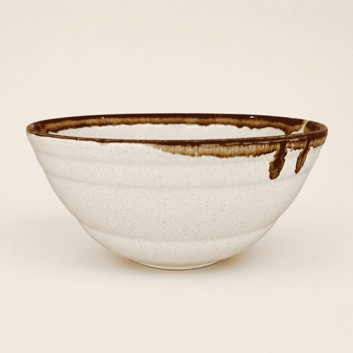 Side view of large Pfaltzgraff brown drip mixing bowl