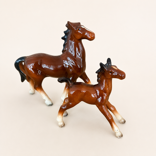 Angled view of vintage Japanese porcelain horse figurine pair