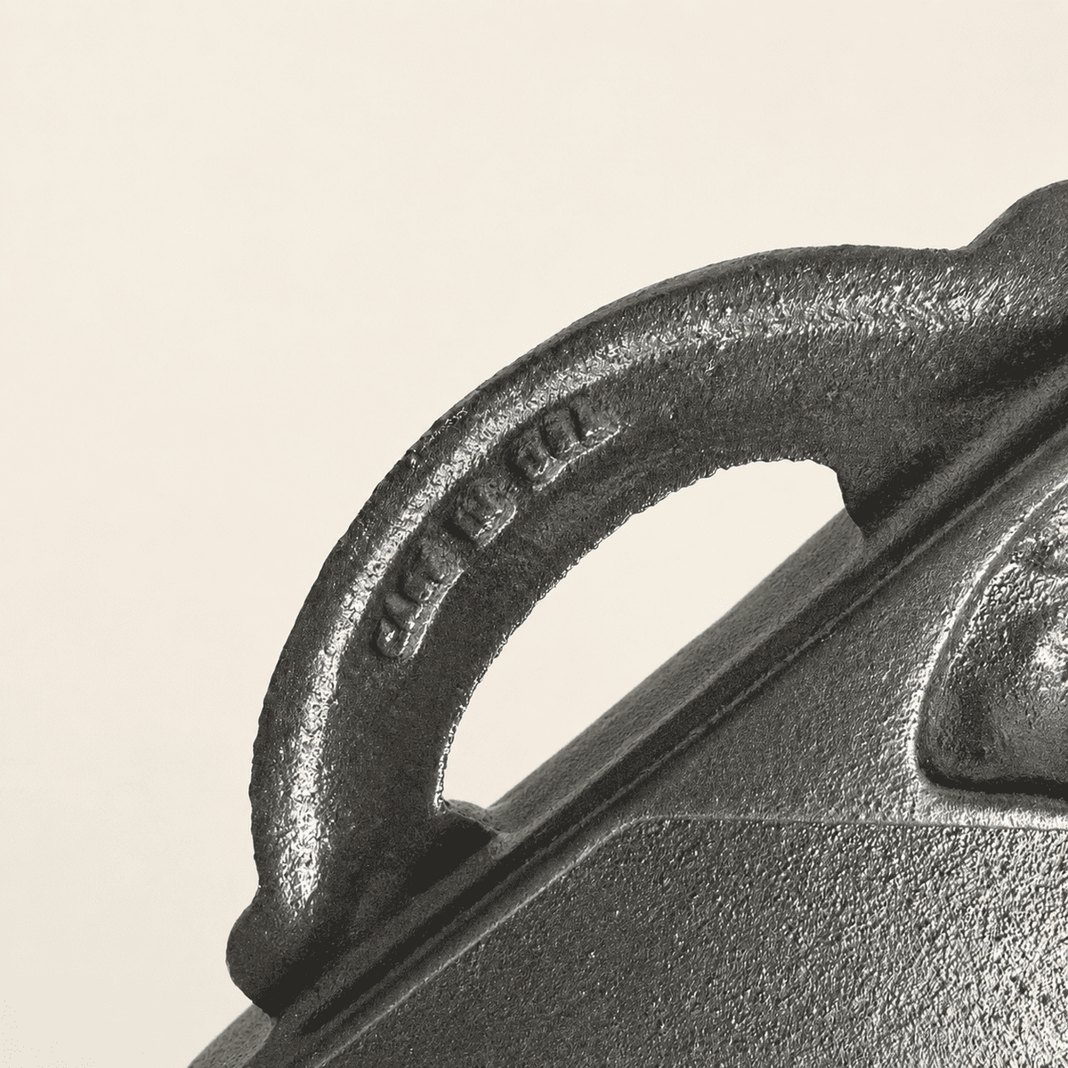 Cast iron handle detail with molded John Wright maker's lettering
