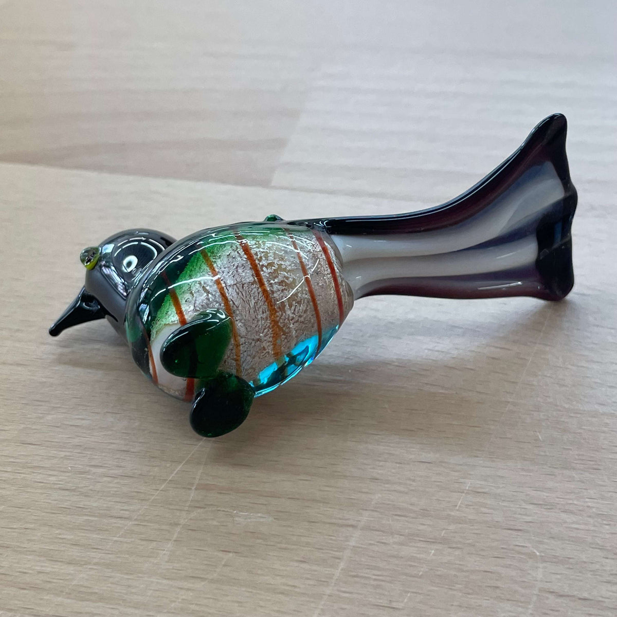 Art glass bird figurine — top view of the swirled glass body