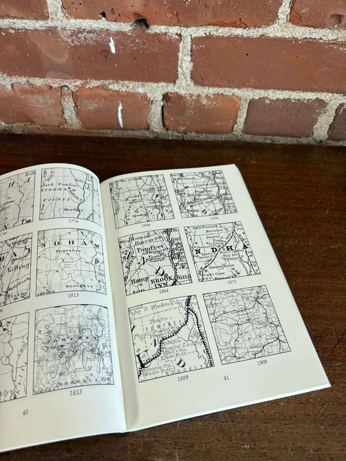 Pomfret history book open to illustrated pages