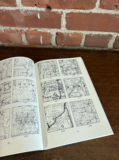 Pomfret history book open to illustrated pages