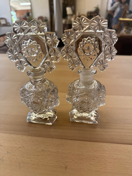 Pair of Cut Glass Art Deco Perfume Bottles with Starburst Stoppers (1930s)