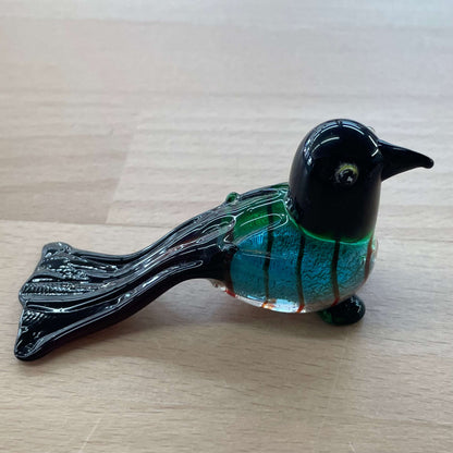Art glass bird figurine — side profile showing long tail