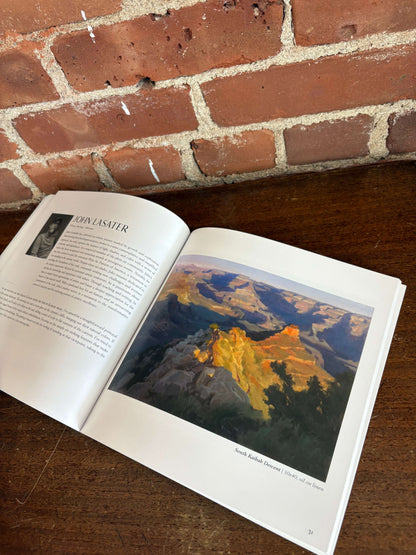 Grand Canyon art book open to a landscape painting page