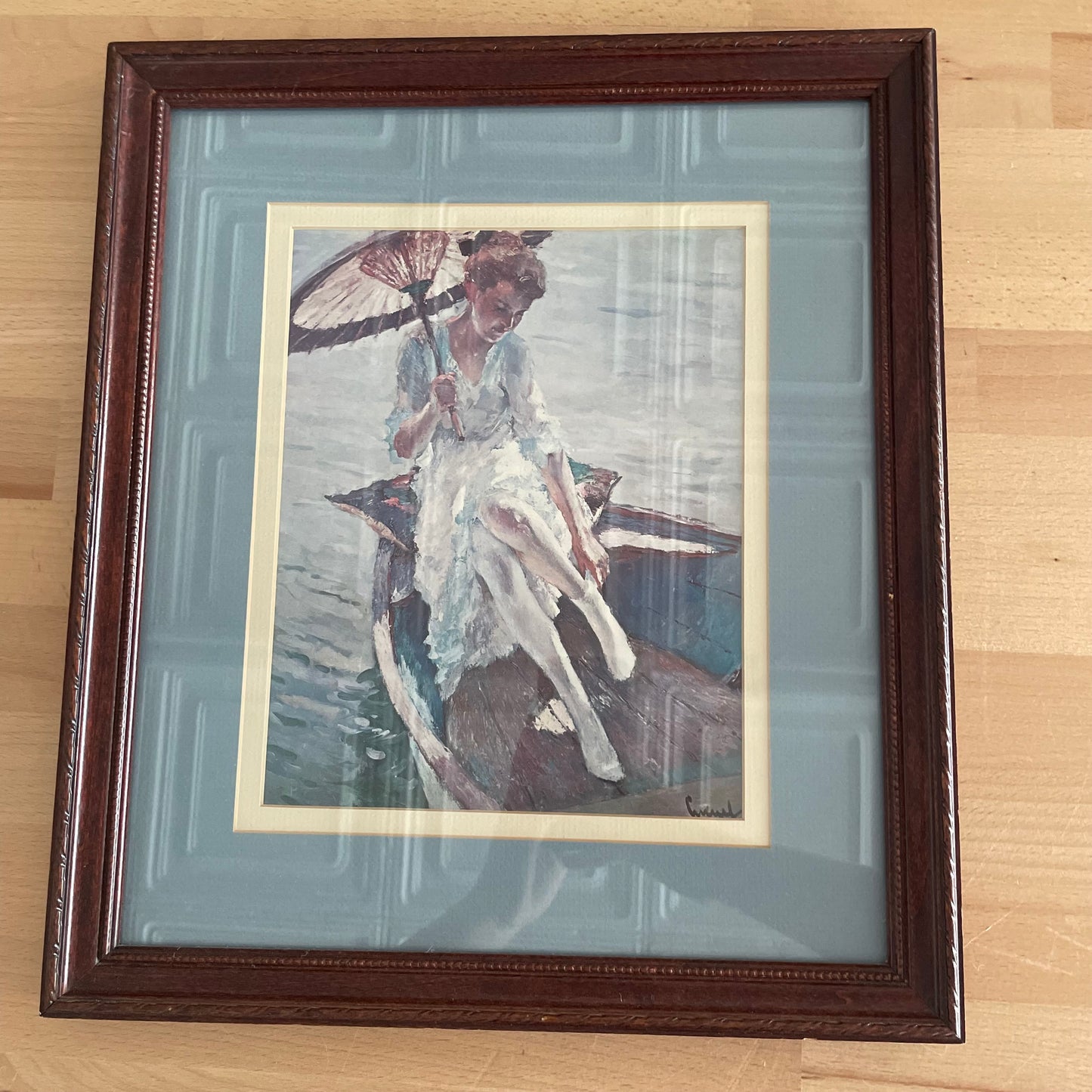 Framed Print of Woman in Boat with Parasol, Signed Artwork in Blue Mat