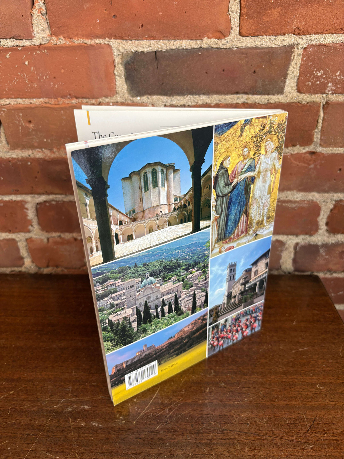Assisi guidebook standing open showing color plates
