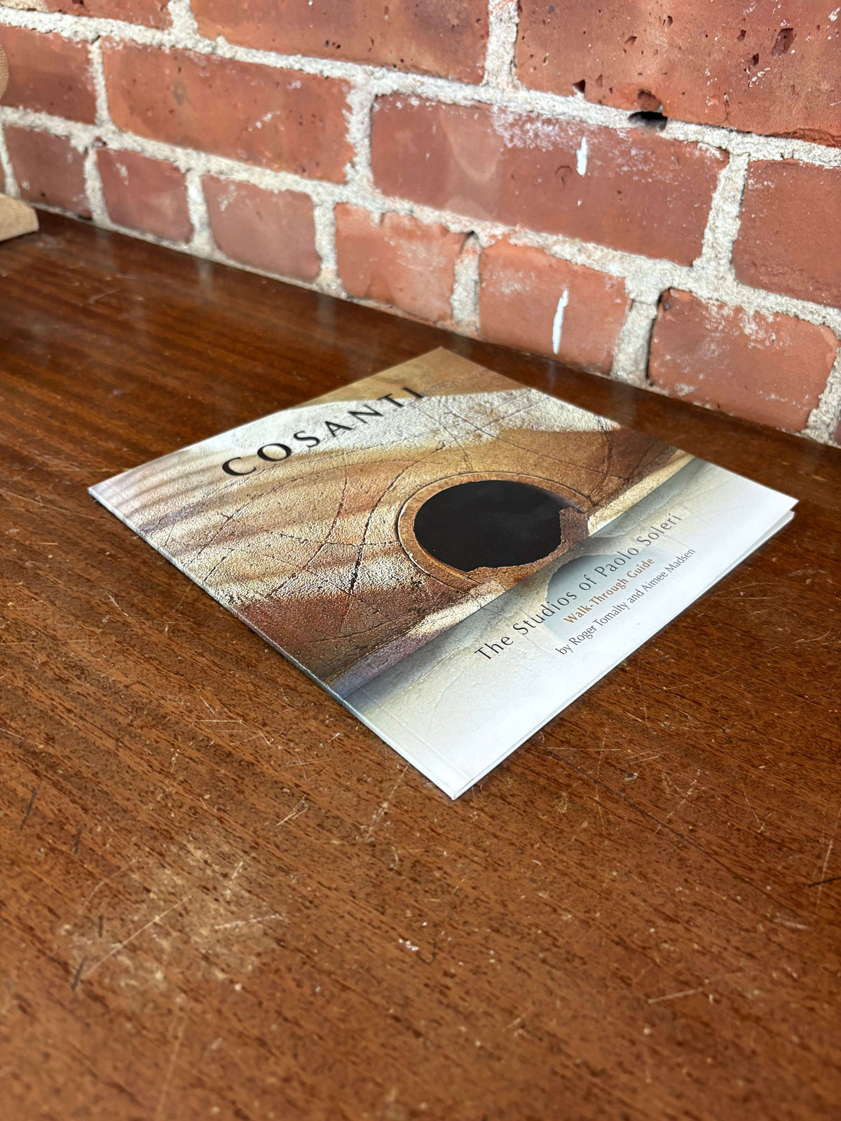 Cosanti book lying flat, angled view