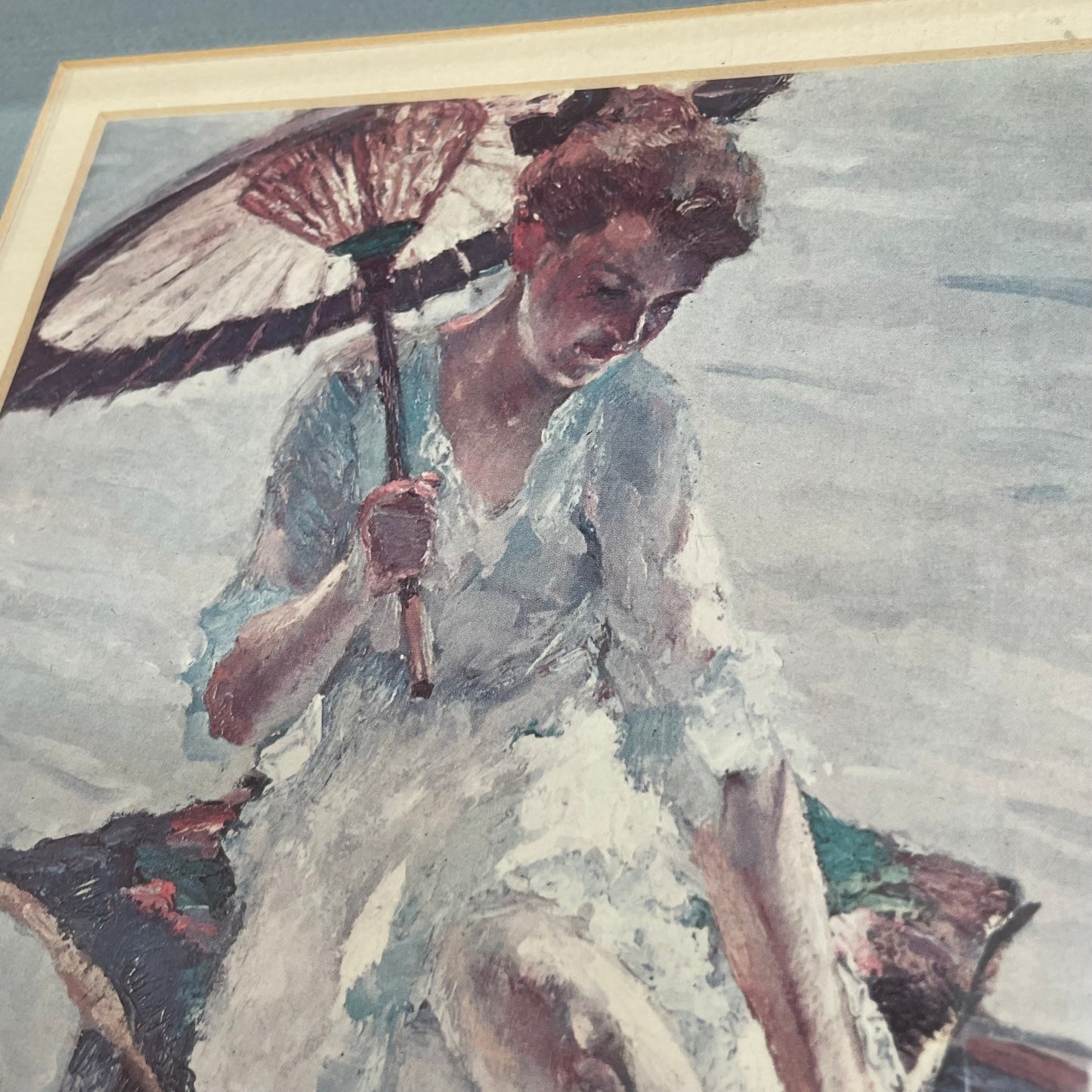 Framed Print of Woman in Boat with Parasol, Signed Artwork in Blue Mat
