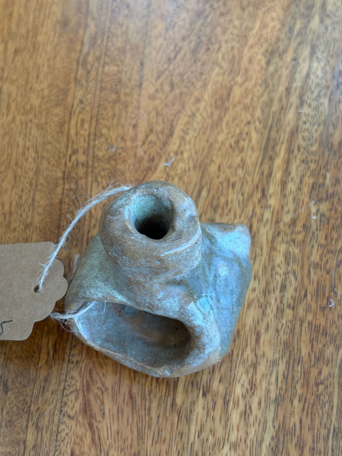 Studio pottery incense burner — arched opening detail