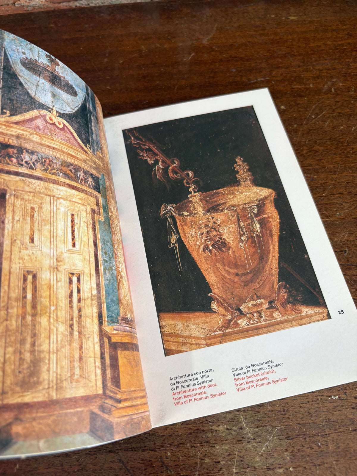 La Pittura Pompeiana book open to a fresco of an urn