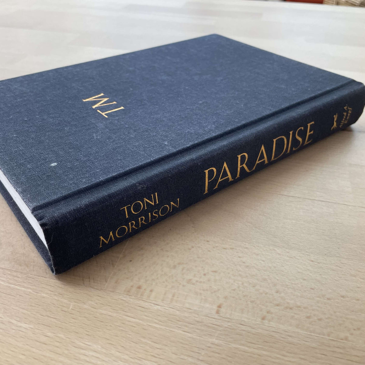 Toni Morrison's Paradise hardcover — navy boards with gilt TM monogram