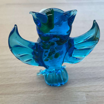 Blue art glass owl figurine — back view of the spread glass wings