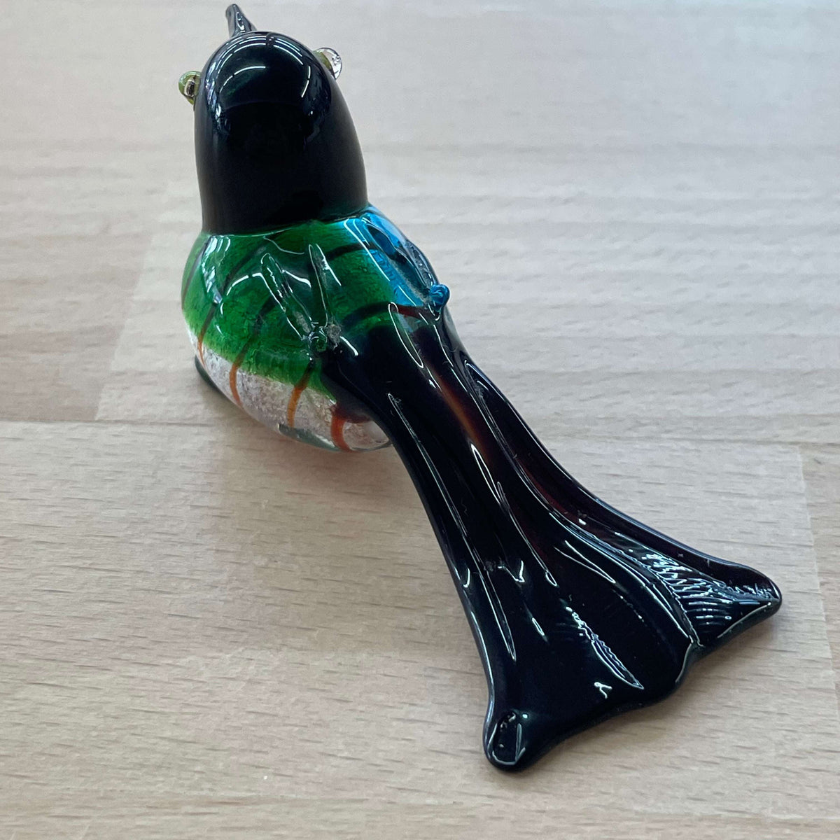 Art glass bird figurine — rear view showing the long tail