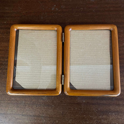 Hinged double wood picture frame — front view of both openings