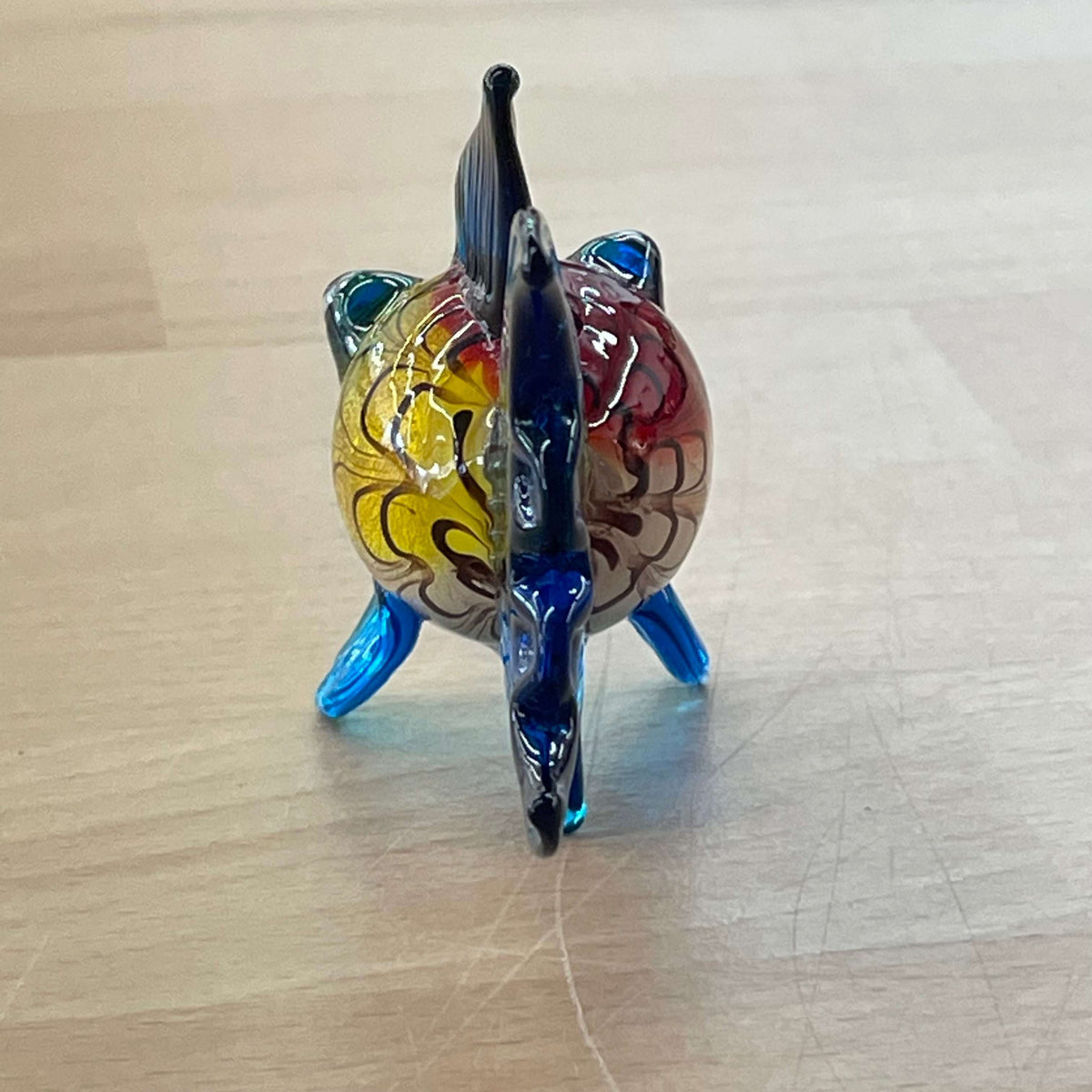Art glass rainbow fish — rear three-quarter view