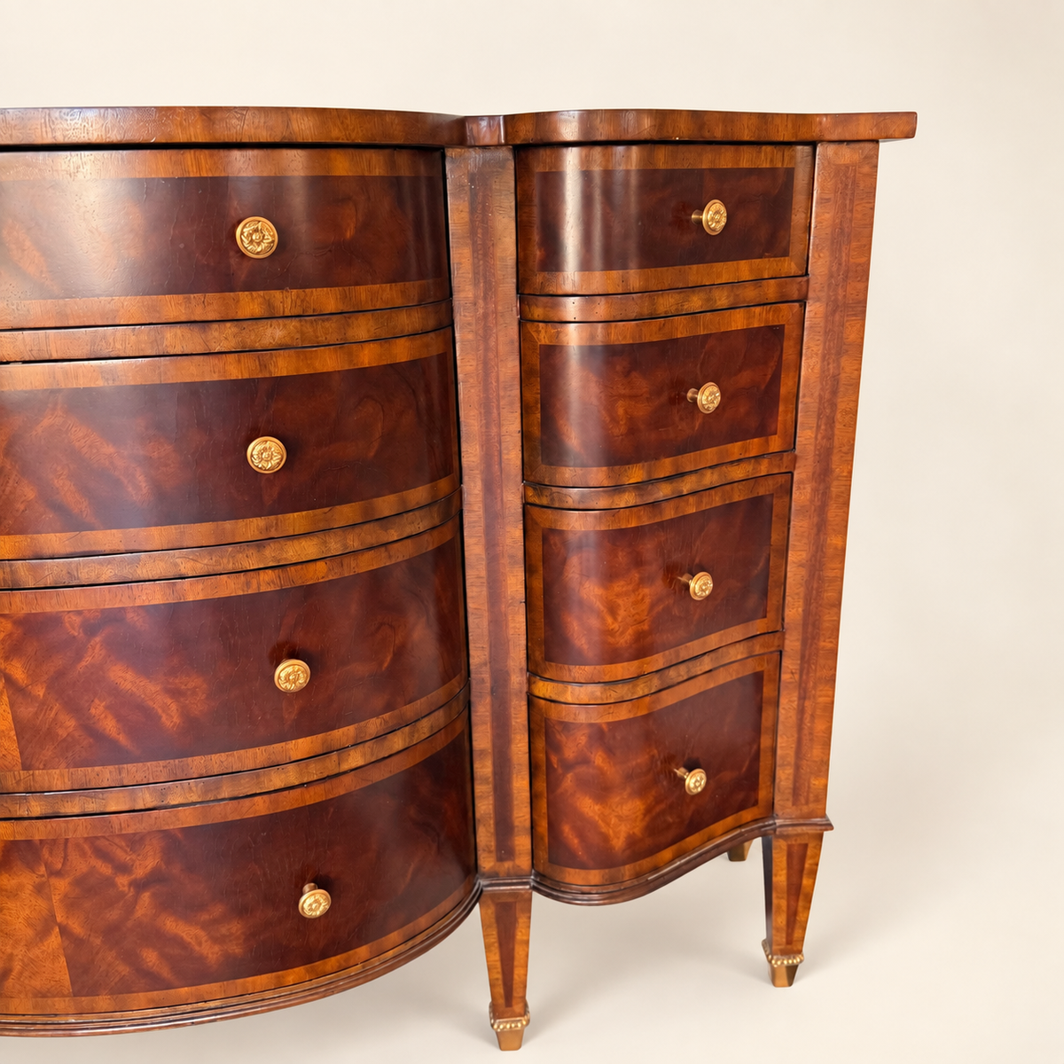 Left bank of serpentine drawers on the Maitland-Smith mahogany commode
