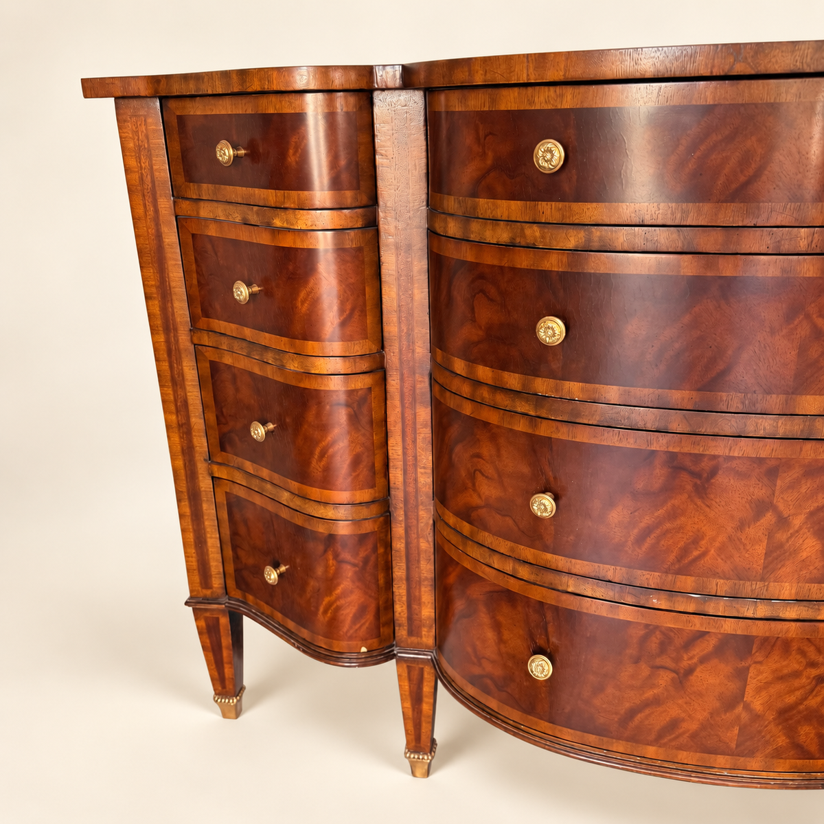 Cast-brass rosette knob and crossbanded flame-mahogany drawer detail