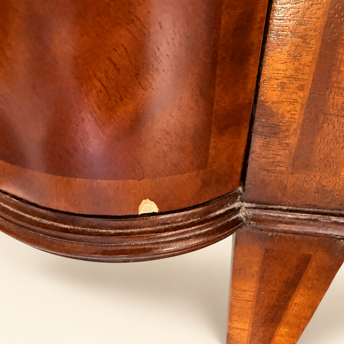 Open drawers and figured mahogany top of the Maitland-Smith commode