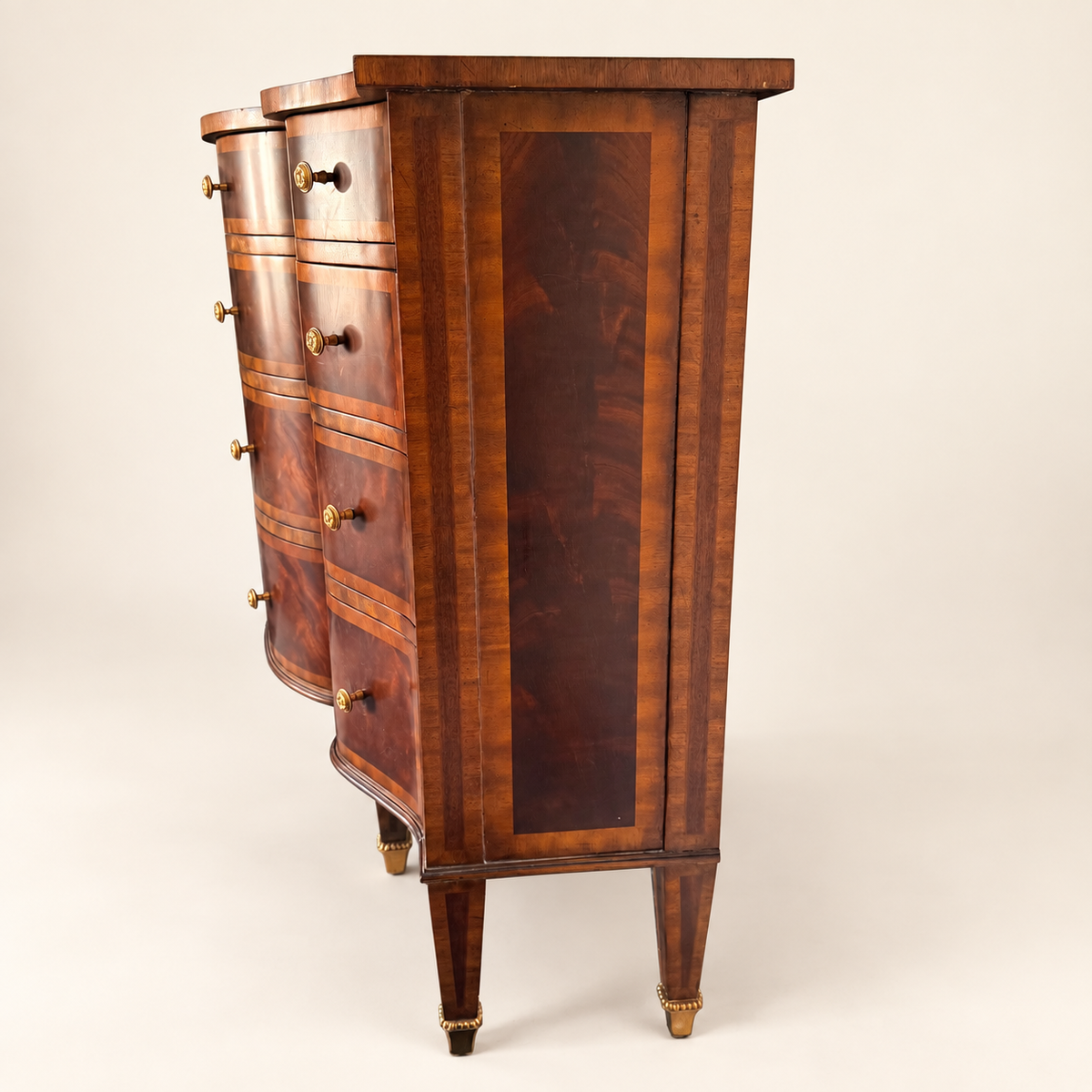 Overhead view of the commode with two drawers open, showing the shaped top
