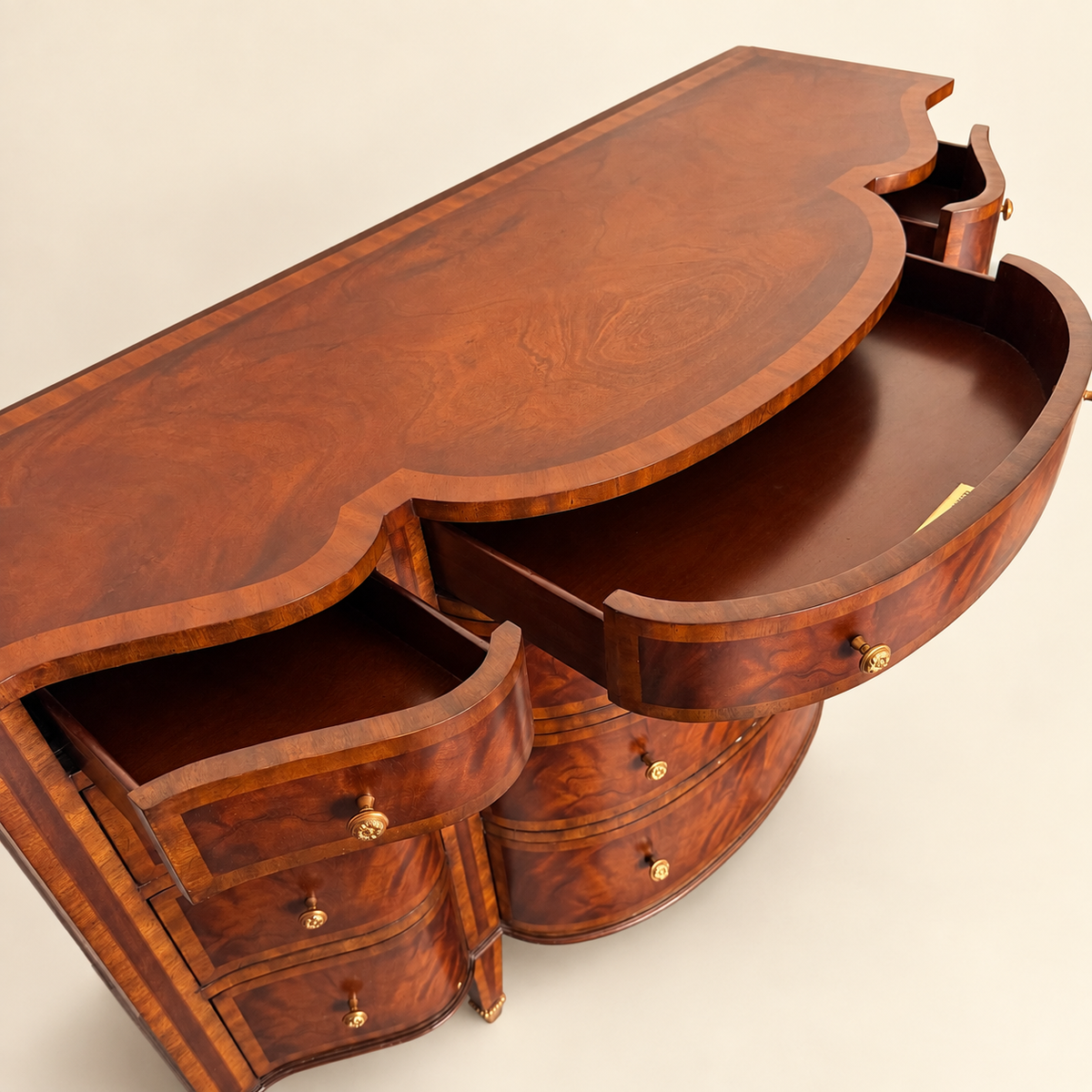 Side profile of the Maitland-Smith flame mahogany commode