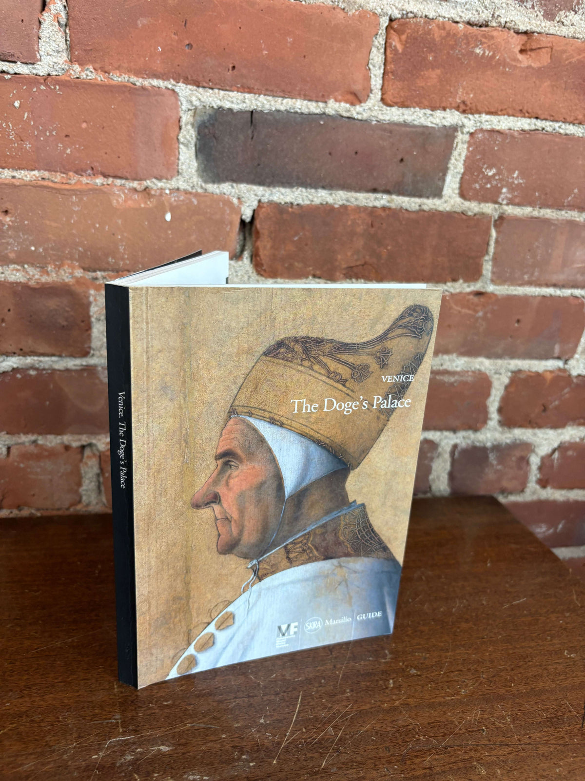 The Doge's Palace Venice guidebook cover with a Doge portrait