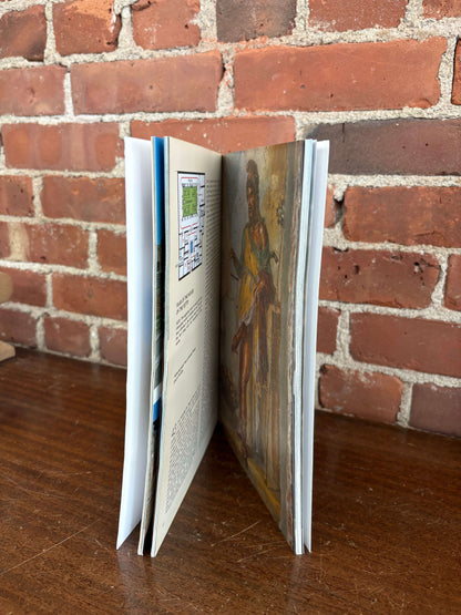 Pompeii guidebook open showing overlay reconstruction pages