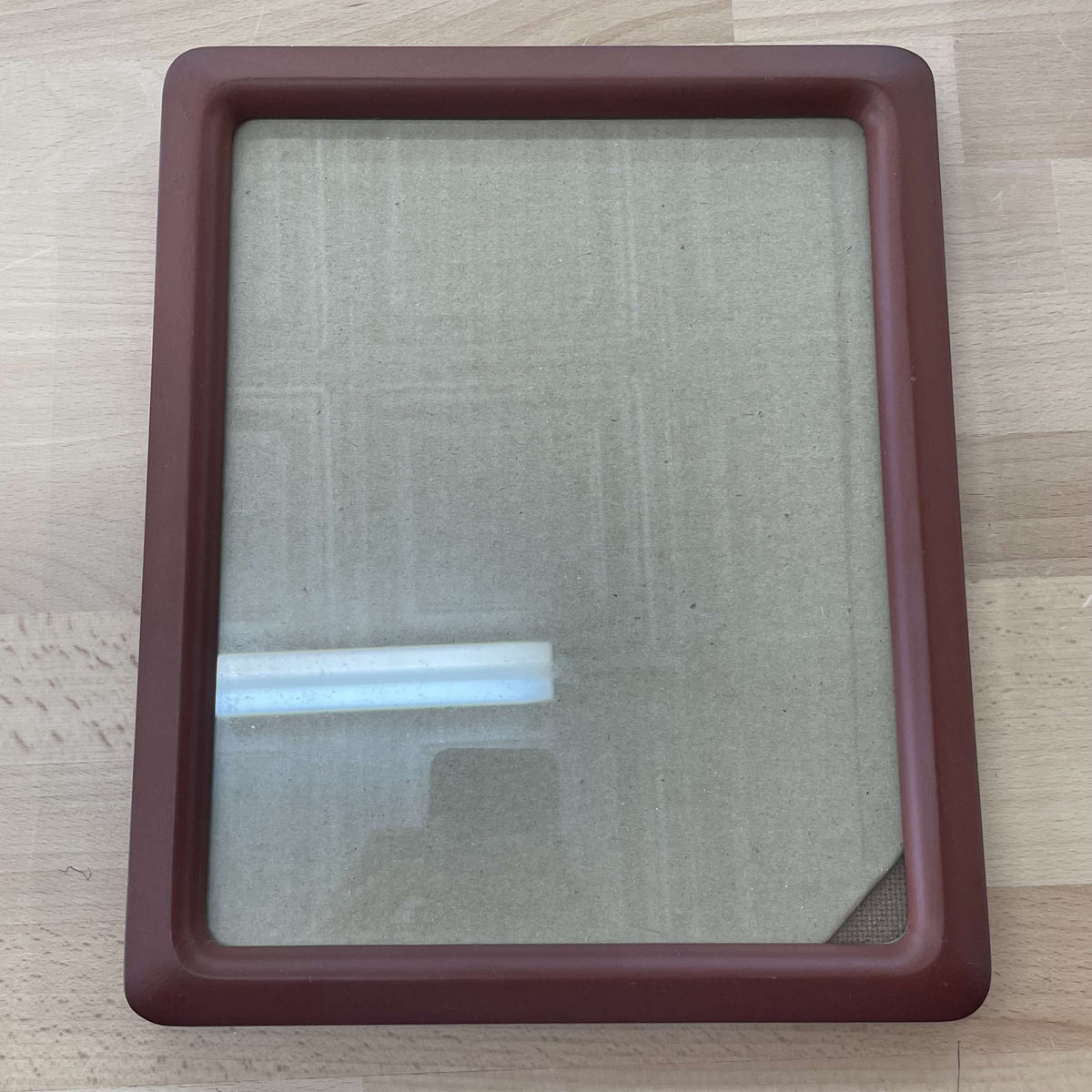 Maroon rounded-edge frame front, angled view