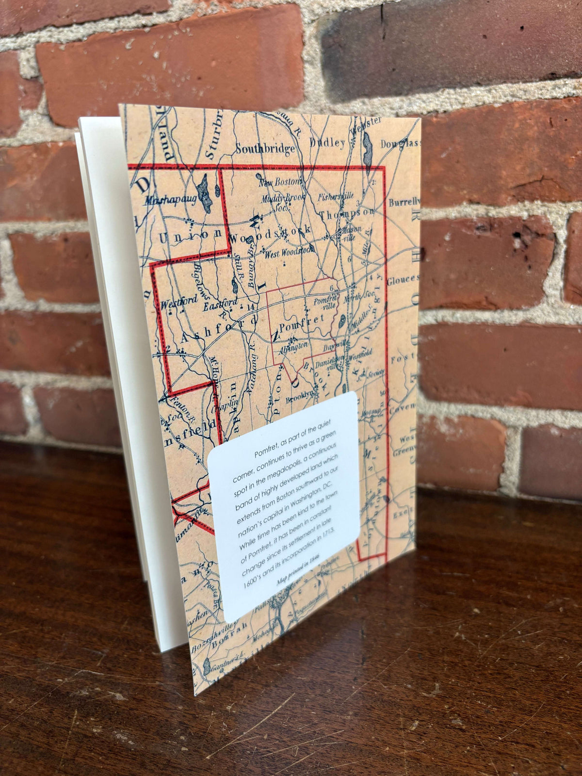 Pomfret history book open to an old map