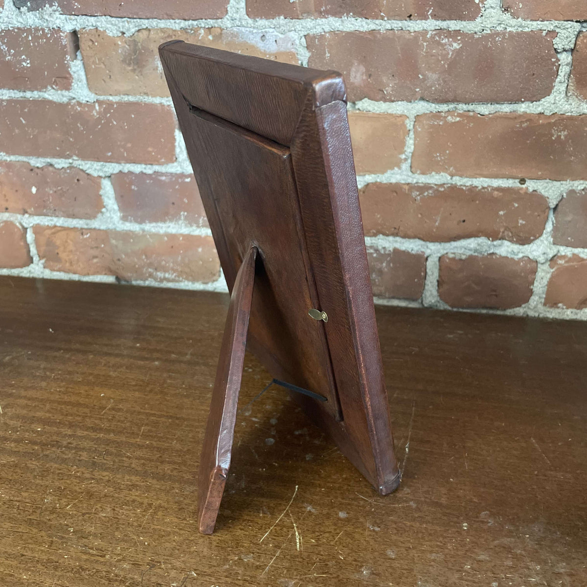 Embellished leather frame side view with easel