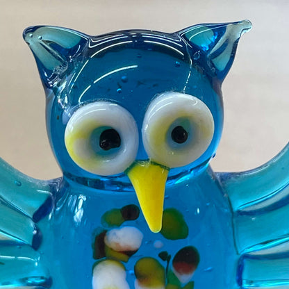 Blue art glass owl figurine — front view with wide white-and-black eyes