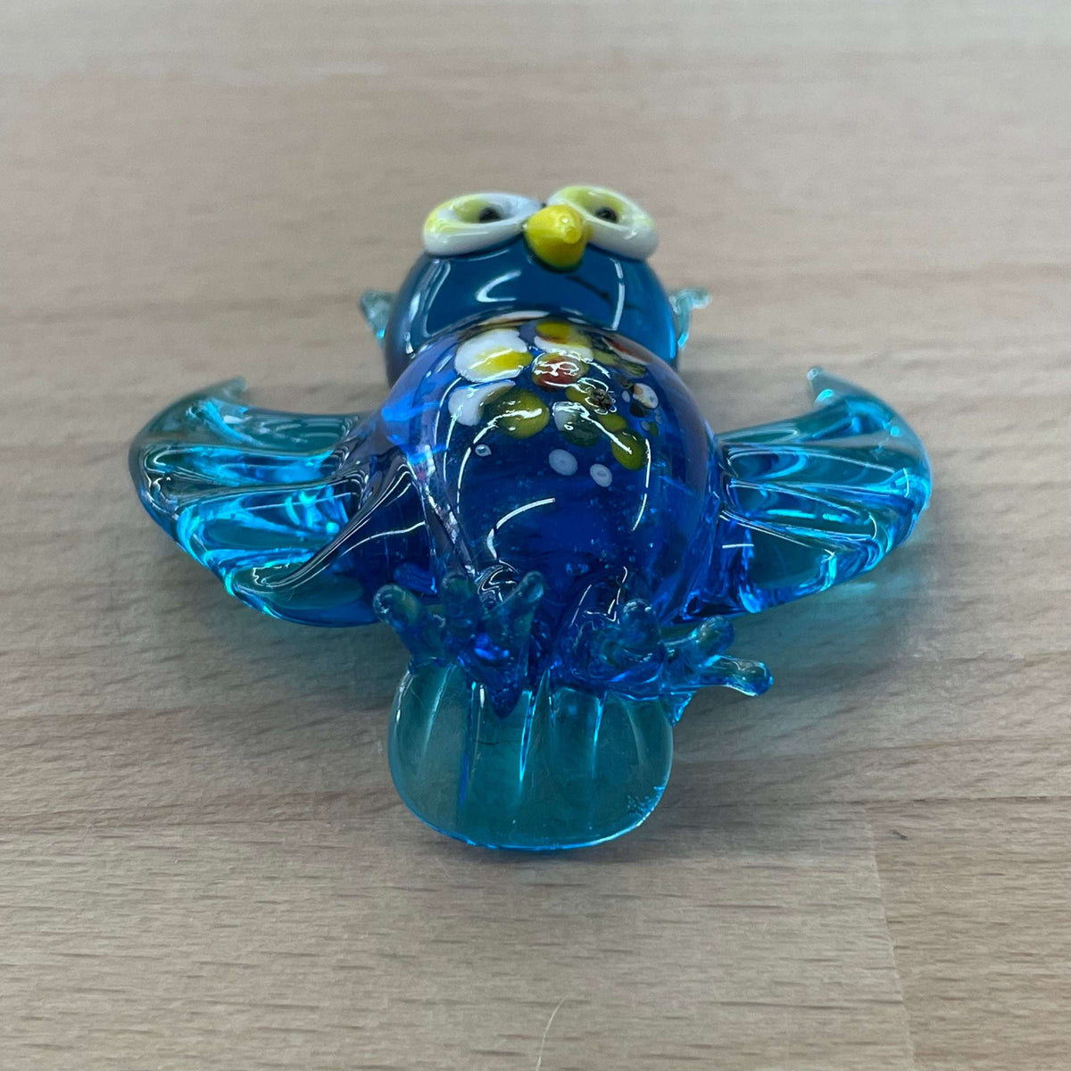Blue art glass owl figurine — top view of the swirled glass body
